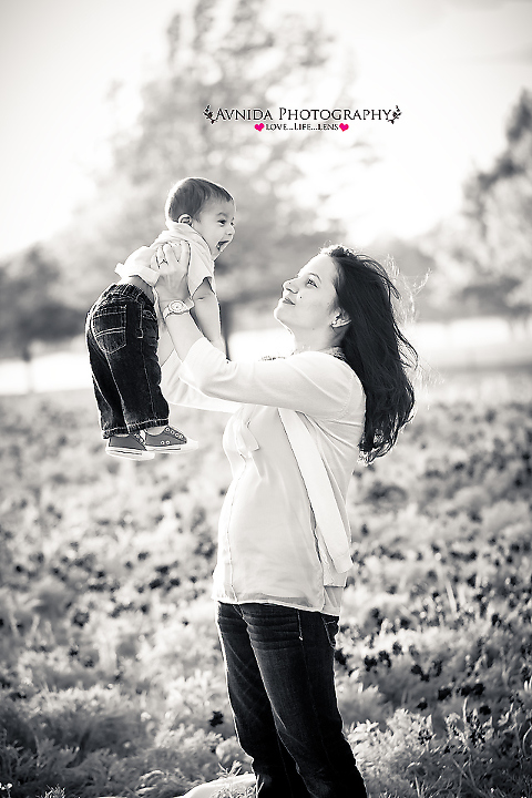 mommy and baby in love in the field of blue bonnets