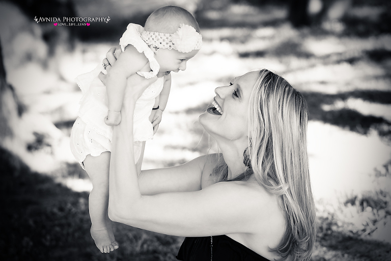 mommy and me - in the air with mommy and smiling - b&w