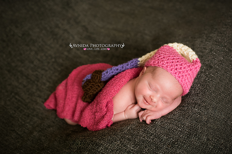 Coco in a colorful hat in Newborn Photography Somerville NJ