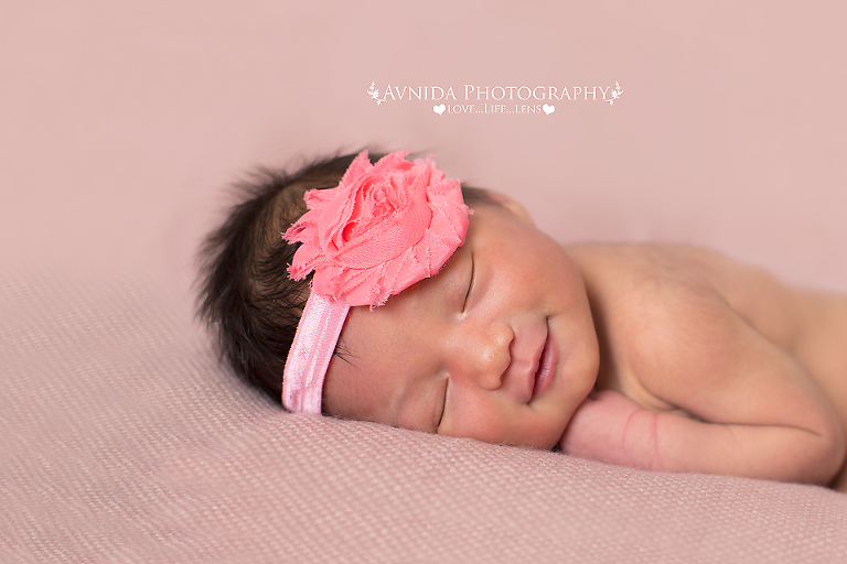 Karter with a flower bow in Montclair NJ newborn baby photographer