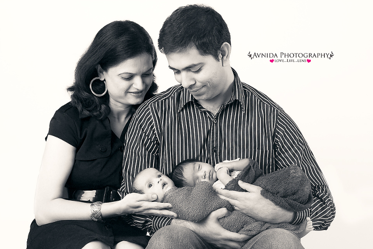 Mom and Dad looking lovingly in this bridgewater nj twins newborn photography session