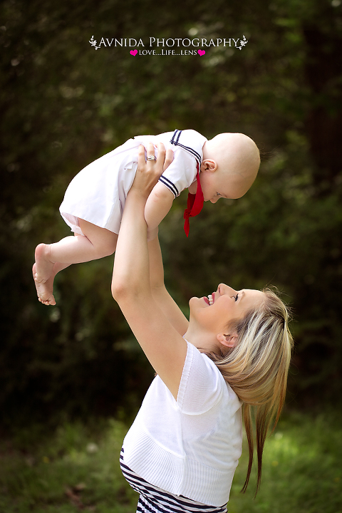 Somerville NJ Baby Photographer Bridgewater taking pictures of mom holding trystan in the air