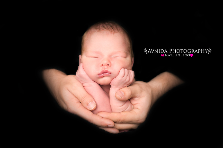 in dad's arms for his Newborn Baby Photography Bridgewaer NJ session