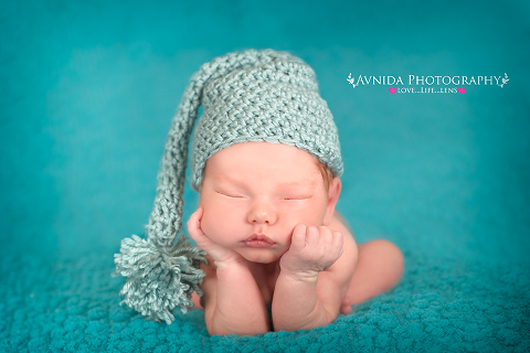 caden chin pose in green for his Newborn Baby Photography Basking Ridge NJ session