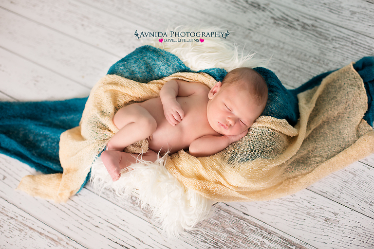 newborn photography - caden with multiple color wraps