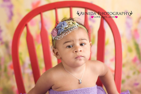 Samantha in the red chair for her Newborn Photography NJ Bergen County