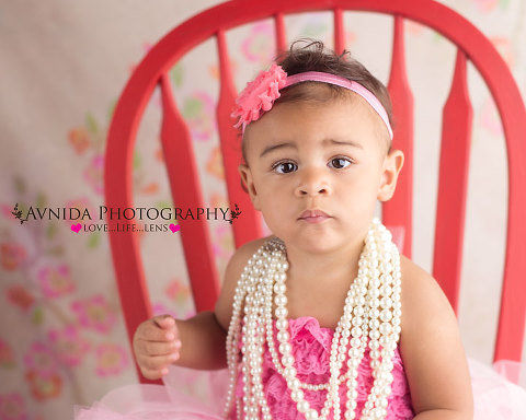 Samantha in the red chair for her Newborn Photography NJ Bergen County