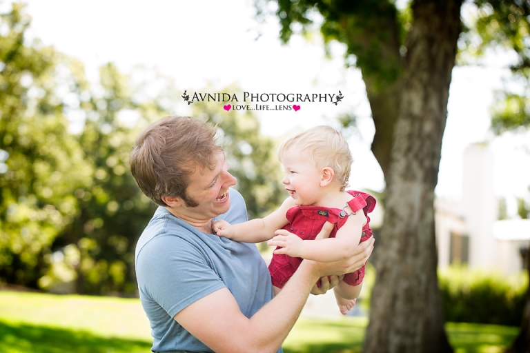 family photography session for one year birthday with dad flying by by Family Photographer Bridgewater New Jersey
