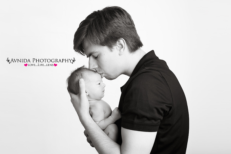 Dad kissing her princess for her photo session by Newborn Photographer Clinton New Jersey