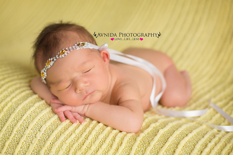 Sweet Madison on a yellow blanket for her photo session by Newborn Photographer Clinton New Jersey