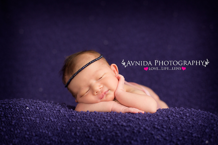 Madison with a chin pose for her photo session by Newborn Photographer Clinton New Jersey