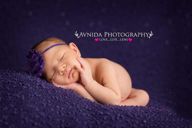 Madison on a purple blanket for her photo session by Newborn Photographer Clinton New Jersey