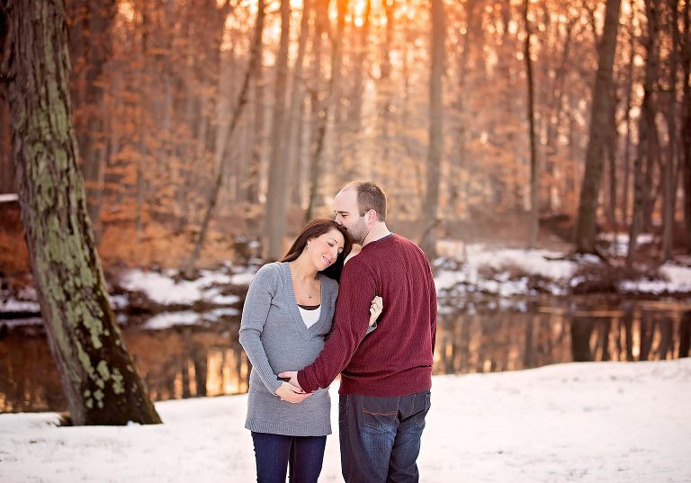 This gorgeous couple cant wait to see their little one while they are enjoying a snow maternity session