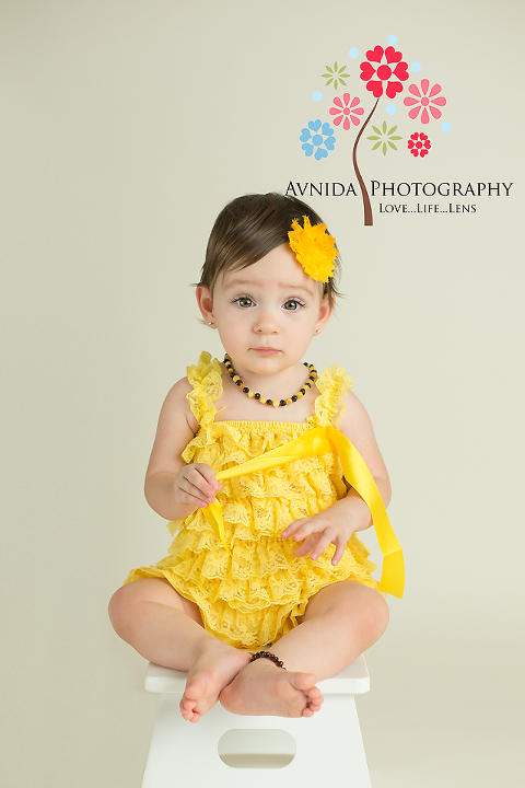 cake smash photography dallas tx in yellow rompers