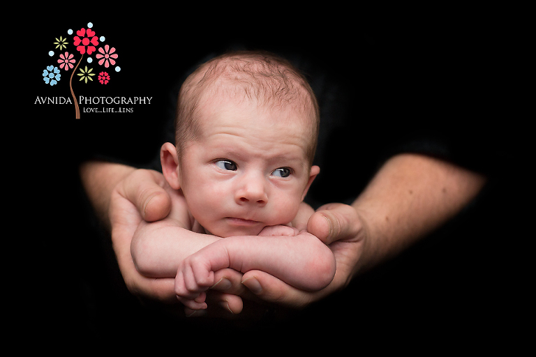 In daddy's arms - a beautiful shot by princeton newborn photographer new jersey