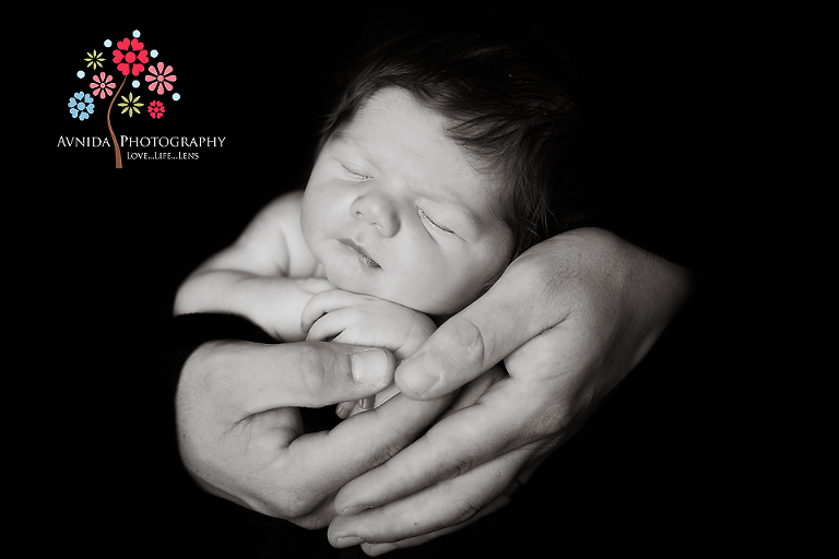 Sleeping in dad's arms in plainsboro new jersey newborn photography