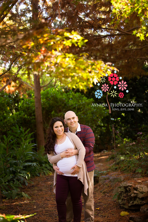 A hug for the mom-to-be during the outdoor maternity photography Basking Ridge NJ