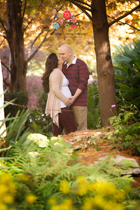 A beautiful kiss during the outdoor maternity photography Basking Ridge NJ