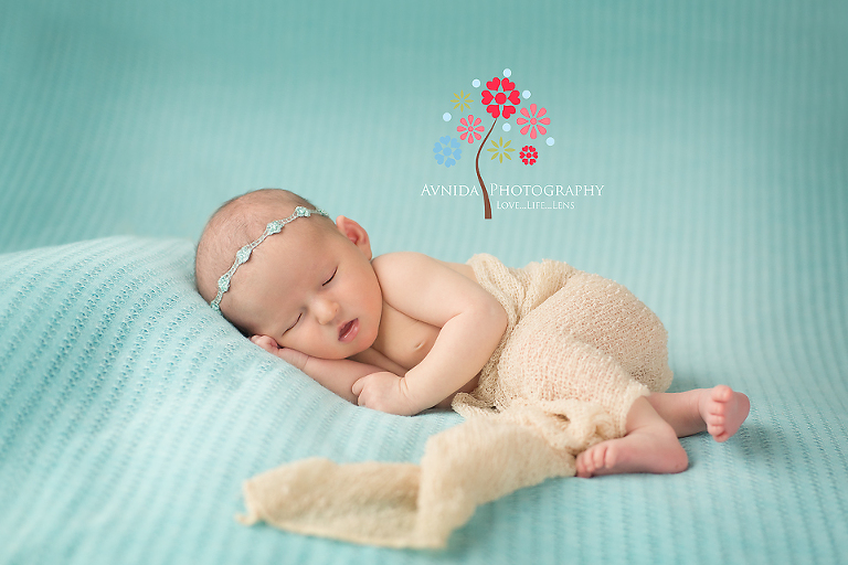 Newborn Photographer Hoboken New Jersey taking pictures of the beauty with green backdrop