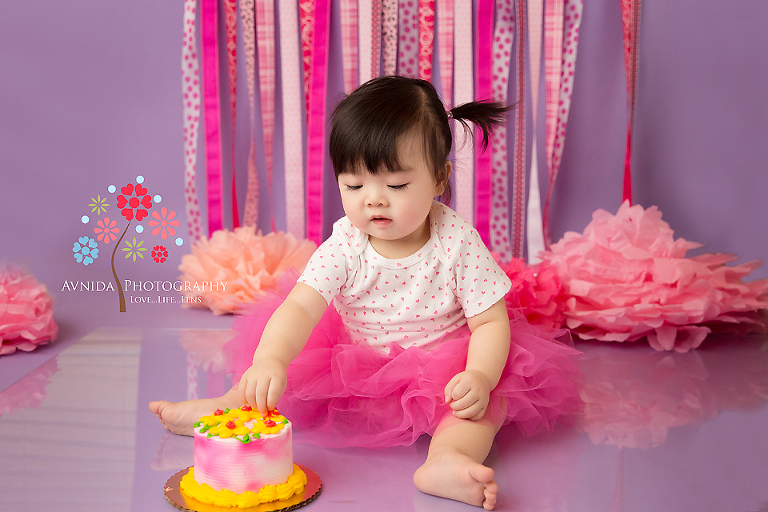 Kailey starts to dig this Cake Smash Photos Paramus New Jersey session