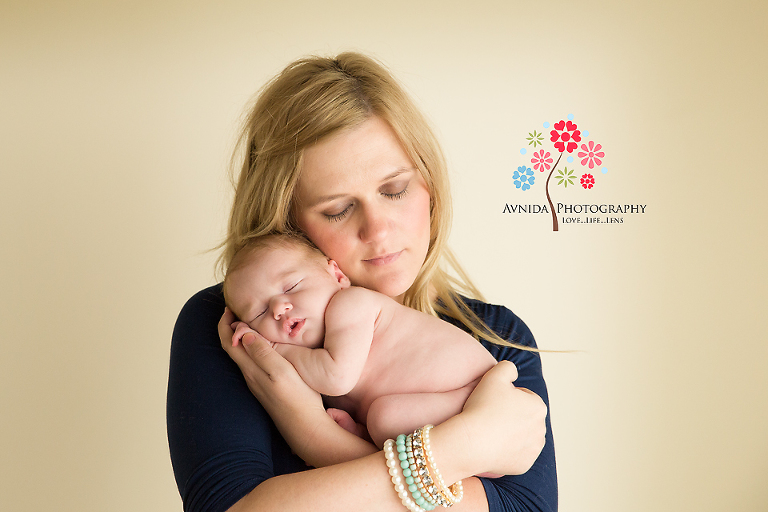 newborn baby photography peaceful in mom's arms