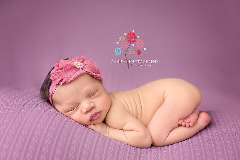 Picture of a cute newborn in the taco pose from your Newborn Photographer Middletown NJ by www.avnidaphotography.com