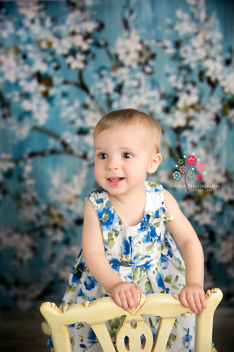 cake smash photography bridgewater nj coco smiling on the chair