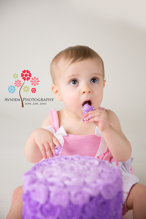 cake smash photography bridgewater nj coco cake in mouth by www.avnidaphotography.com