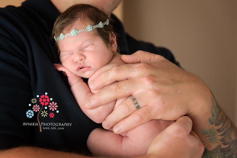 Sleeping comfy in daddy's arms during her Short Hills NJ Newborn Photography session