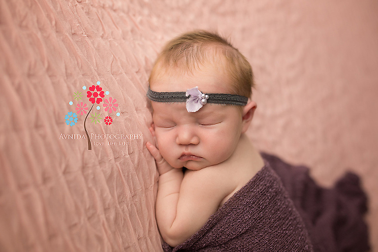 Newborn-Photographer-Alpine-NJ---a-little-brown---a-little-purple---and-a-small-flower-headband