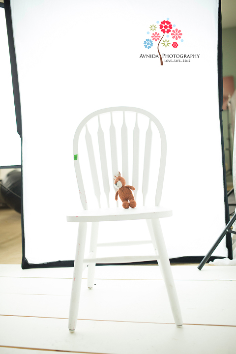 High-Key Lighting setup tutorial by Avnida Photography, finest studio for Newborn Photography NJ. SOOC photograph with one soft box or window light and a reflector.
