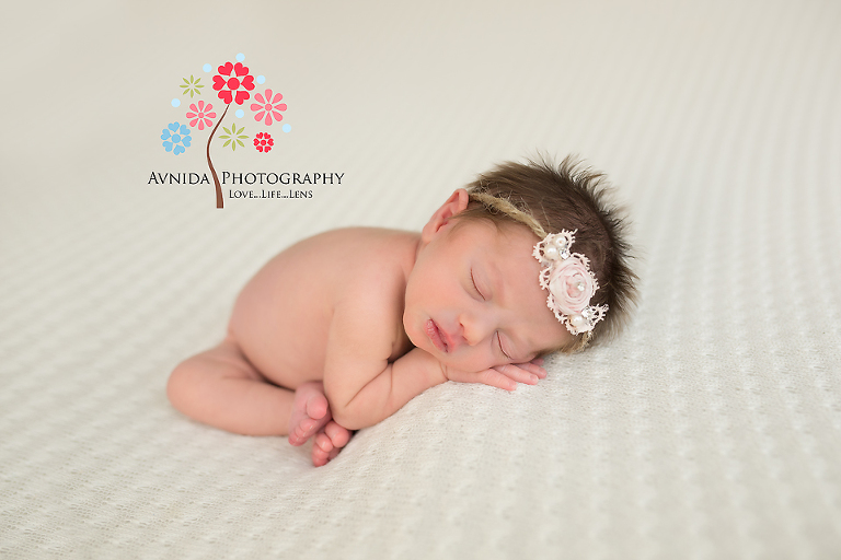 Mya in the white headband for her newborn photo shoot