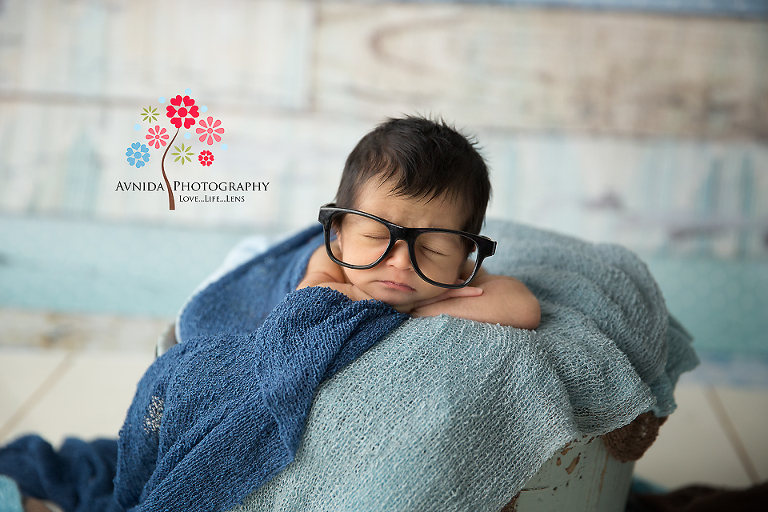 Avnida Photography, NJ's best newborn photographer, and Baby Remington in his stylish glasses. How to create the perfect environment for newborn photography sessions?