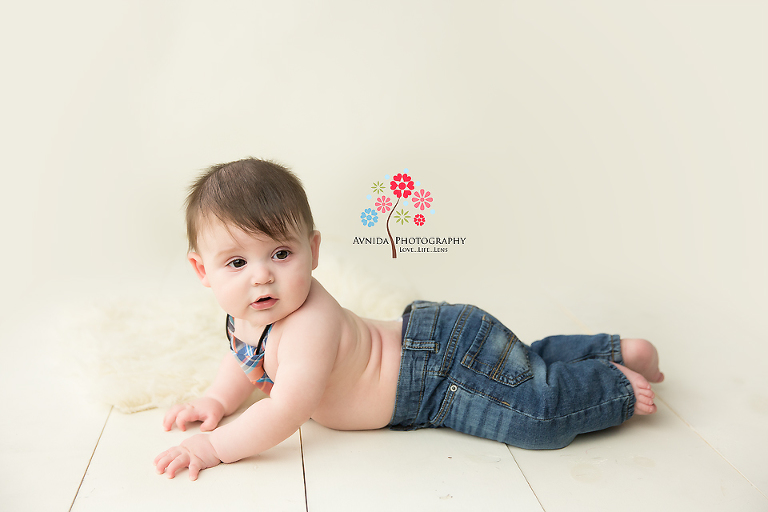 Jacob takes a moment to do some pushups during his baby photography session