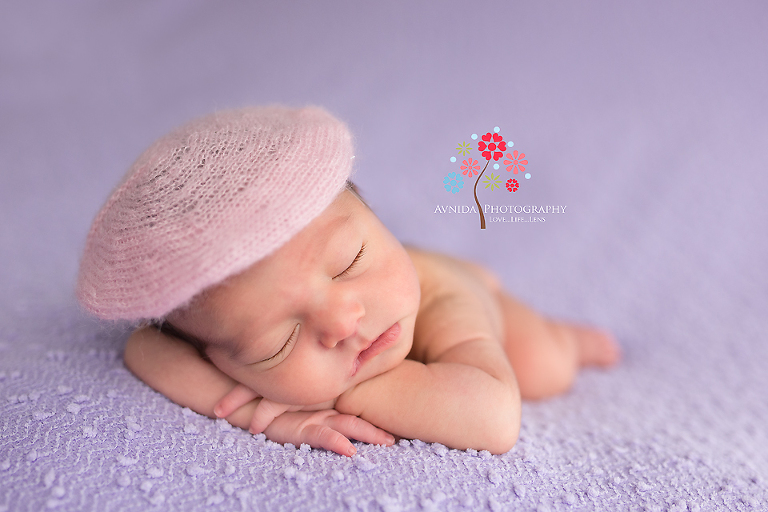 With the hand on the chin and the cute pink hat, Emma looks lovely in this photo from her 4 week old newborn photography session
