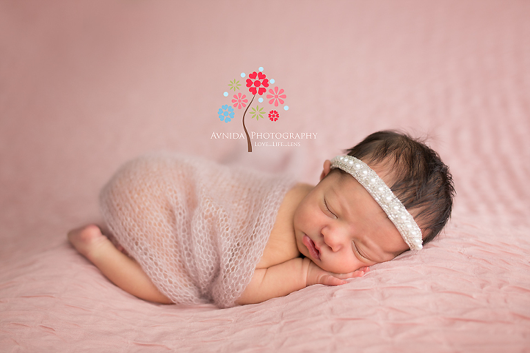 Rocking it with yet another perfect pose for her 4 week old newborn photography session