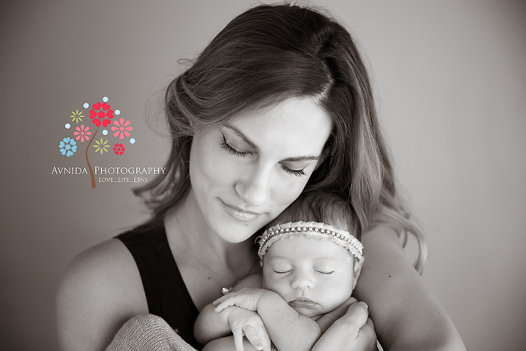 Mom and baby both look really beautiful in this black and white photograph from Viviana's newborn photo session