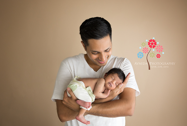 Dad caught red handed being all smitten with her newborn baby girl