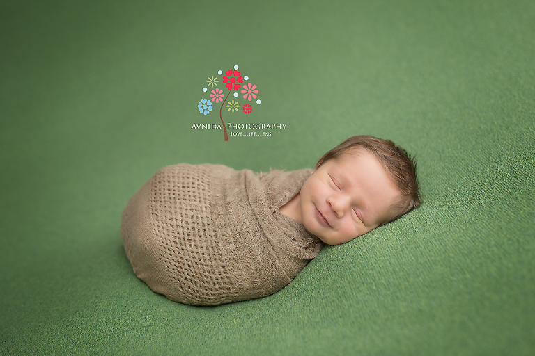 Getting a newborn to smile. Newborn Picture Ideas by Avnida Photography.