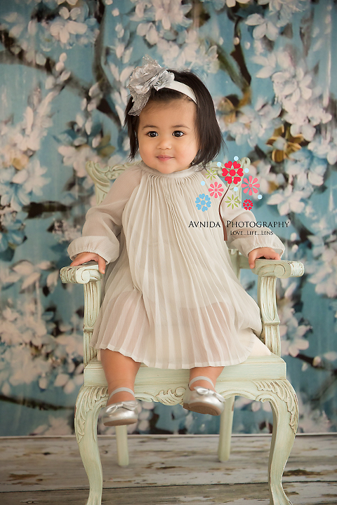 The princess poses for her portrait session sitting on her throne - photos by Avnida Photography