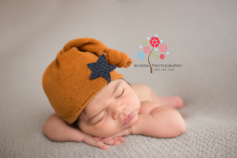 Verona NJ newborn photographer - Baby Marcos repeats the perfect hands on chin performance in a cute newborn cap