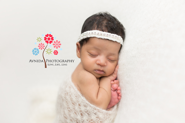 Edgewater NJ newborn and maternity photographer - The joy of complete white combination - the headband, the wrap and the blanket