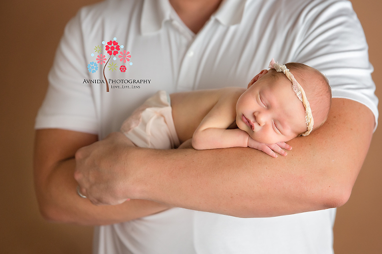 Newborn Photographer Ridgewood NJ - resting comfortably in daddy's arms