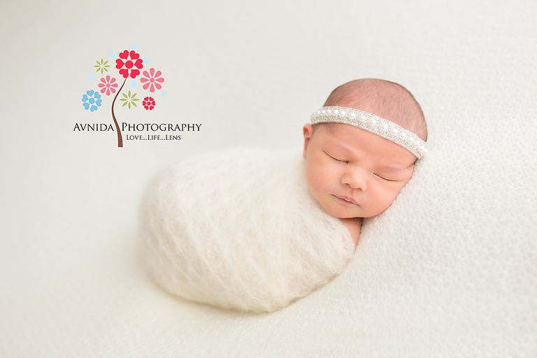 Newborn Photographer Ridgewood NJ - The complete smogarsboard of white, with white light, white blanket, white wrap and a white headband