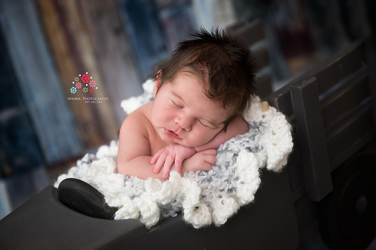 Newborn Photographer Somerset NJ - A stylish rug to go along with a rugged truck, this kid has it all