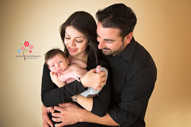 Mom & Dad swoon over their little angel...who is a bit unsure of how to react to this newfound fame :) - Newborn Photography Saddle River NJ