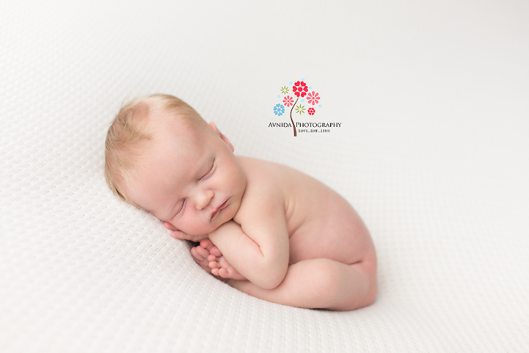 Newborn Photographer Lyons NJ - There is nothing better than a simple white blanket with a calm, sleeping baby posing on it for his newborn photoshoot