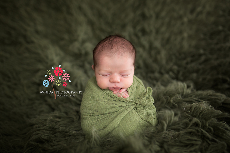 Newborn Photography New Brunswick NJ - Sea of green. I always love how the cute little hands peek out :)