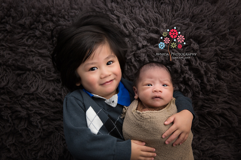 Newborn Photography Bound Brook NJ - Apparently, little brother isn't excited. Why? We don't know.