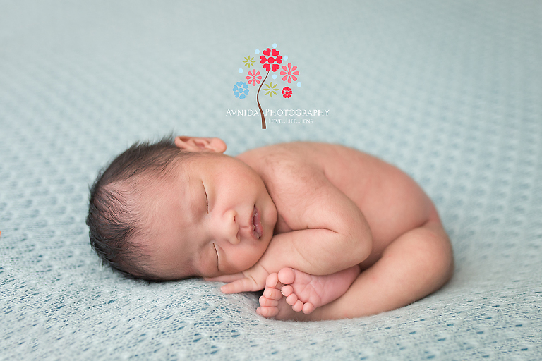 Newborn Photography Bound Brook NJ - The simplicity of a pastel color. And the perfect pose which takes years of training to get right.